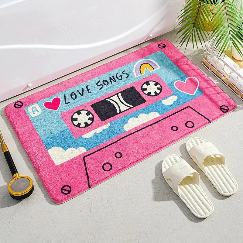 VibeCore Cute Cassette Accent Rug in pink, featuring a nostalgic cassette tape design with a plush texture and non-slip backing, perfect for adding a retro touch to any space.