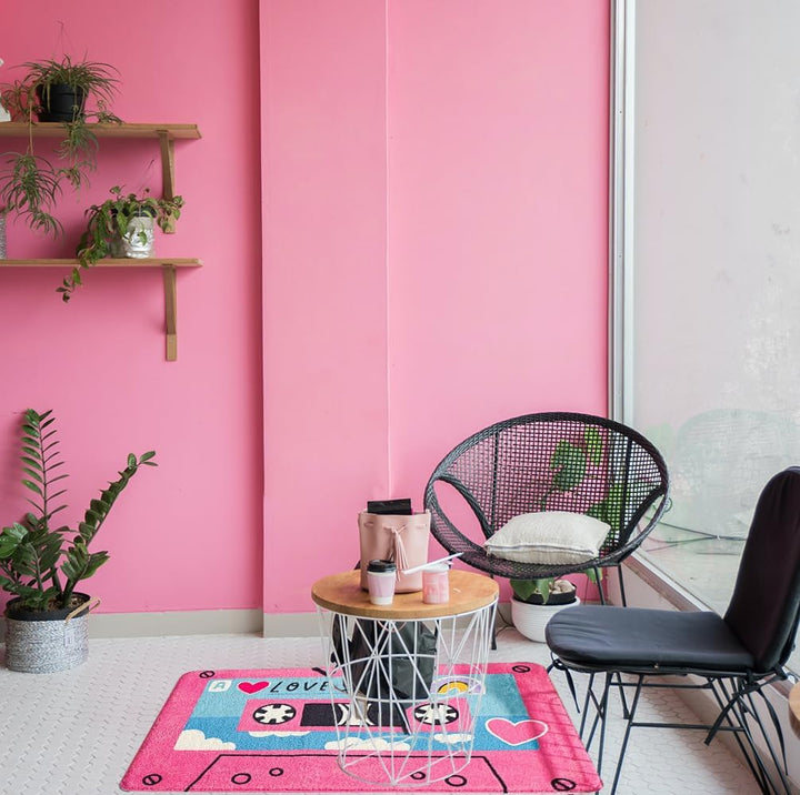 VibeCore Cute Cassette Accent Rug in pink, placed on the floor, showcasing a retro cassette tape design with vibrant colors and a plush texture. Perfect for adding a nostalgic, playful touch to any room with its non-slip backing for safety.