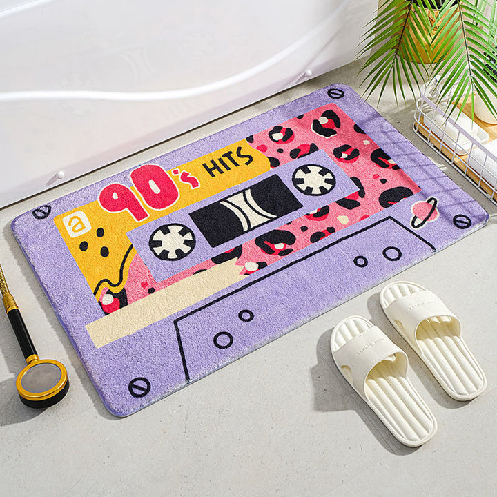 VibeCore Cute Cassette Accent Rug in purple, designed with a retro cassette tape motif, soft plush texture, and non-slip backing, ideal for adding a nostalgic and playful touch to any space.