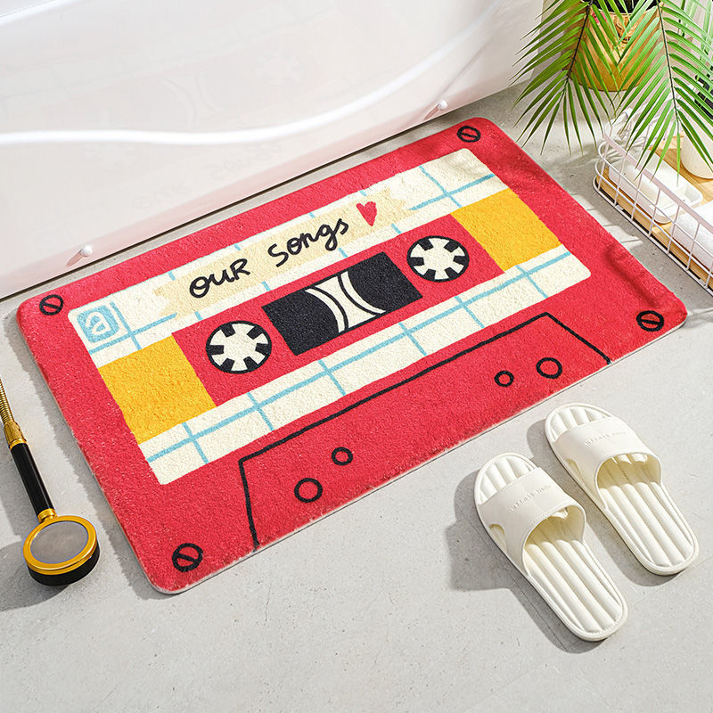 VibeCore Cute Cassette Accent Rug in red, featuring a nostalgic cassette tape design with a soft, plush texture and non-slip backing, perfect for adding a retro touch to any space.