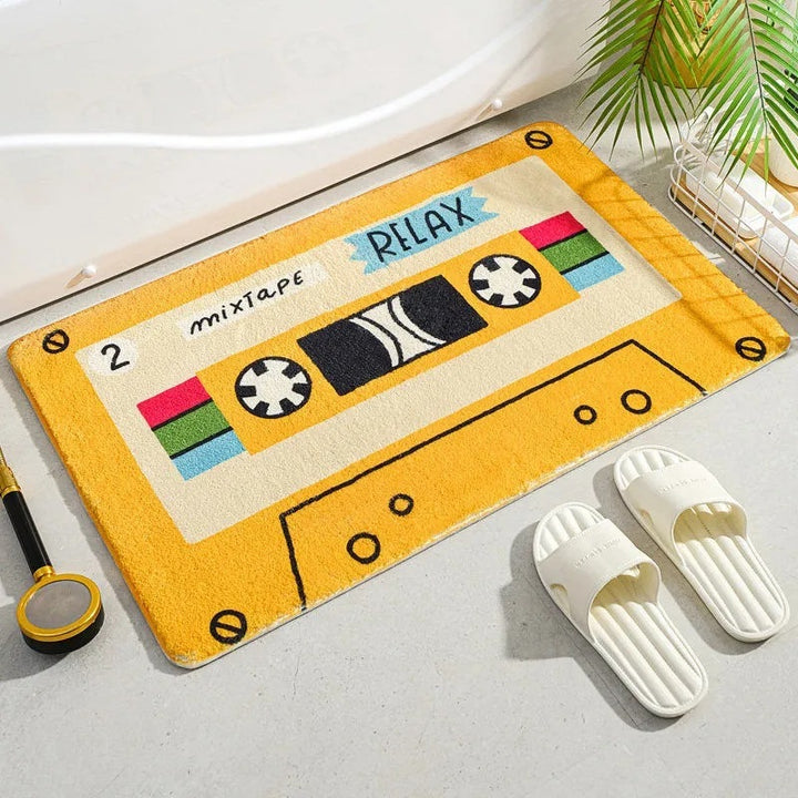 VibeCore Cute Cassette Accent Rug in yellow, featuring a vibrant cassette tape design with soft, plush texture and a non-slip backing, adding a nostalgic and playful vibe to any space.