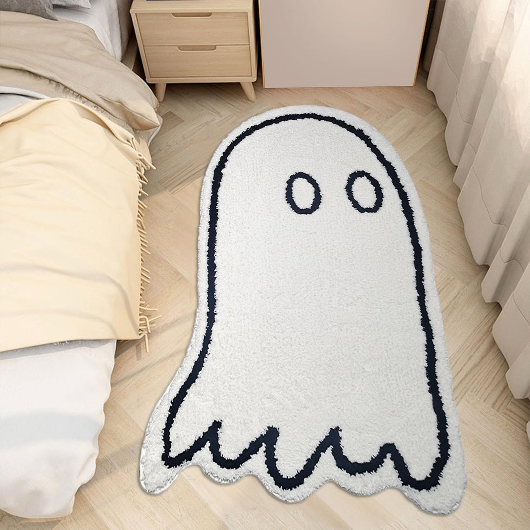 VibeCore Cute Ghost Accent Rug beside a bed, featuring a playful and spooky ghost design, adding a fun and cozy touch to the room with its soft, plush texture and whimsical black and white colors.