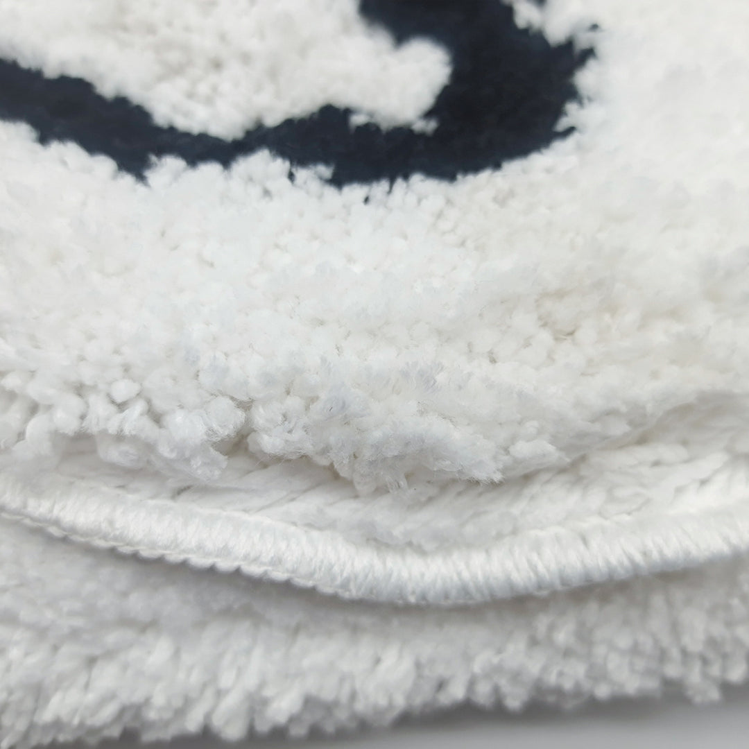 Close-up of the VibeCore Cute Ghost Accent Rug material, highlighting the soft, plush texture and durable stitching.