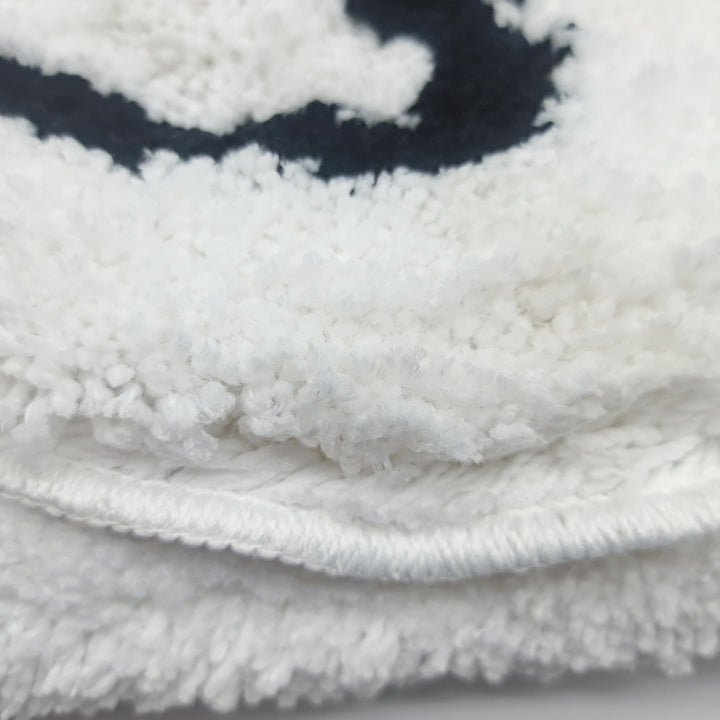 Close-up of the VibeCore Cute Ghost Accent Rug material, highlighting the soft, plush texture and durable stitching.