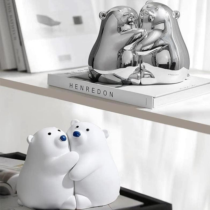 VibeCore Cute Hugging Bears Bookends with two silver noses and two blue noses, playfully supporting books on a shelf, adding charm to any room.