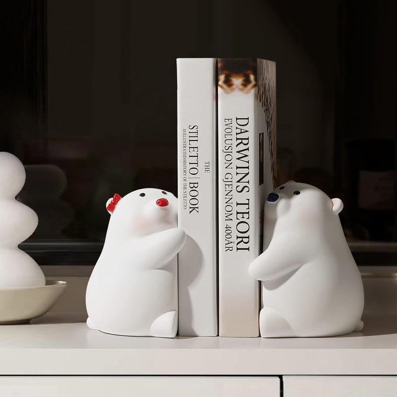 VibeCore Cute Hugging Bears Bookends with one bear having a red nose and the other a blue nose, designed to support books on a shelf with a charming embrace.