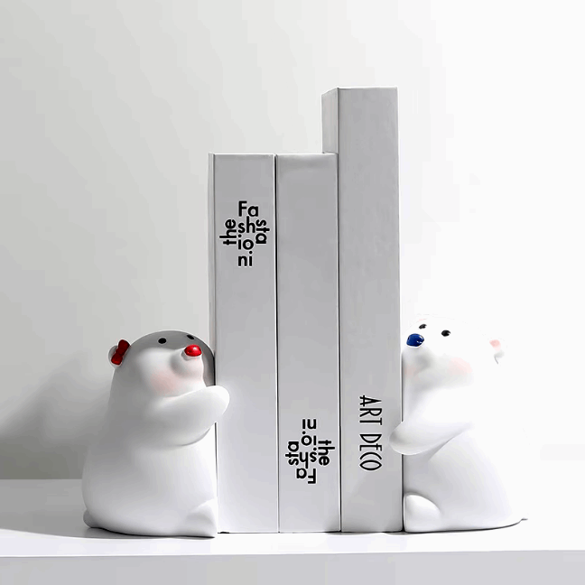 VibeCore Cute Hugging Bears Bookends with red nose and blue nose, holding books in place on a shelf.