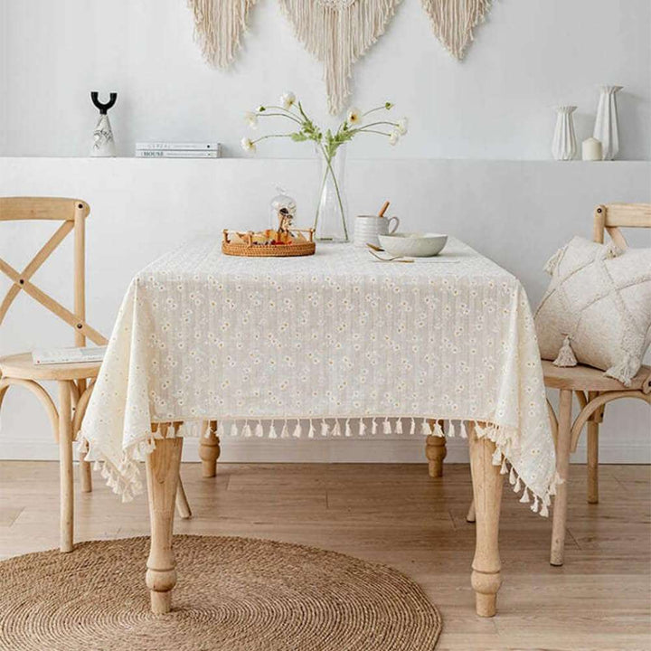 VibeCore Daisy Embroidered Linen Tablecloth, featuring delicate daisy embroidery and tassel accents, crafted from high-quality linen for a charming, fresh touch to your dining space. Ideal for both special occasions and everyday use.