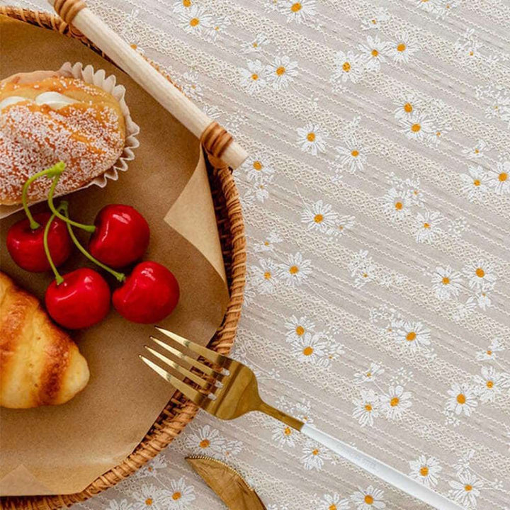 VibeCore Daisy Embroidered Linen Tablecloth in gray, close-up of the pattern, showcasing the intricate daisy embroidery and soft, high-quality linen texture for a refined and charming touch.