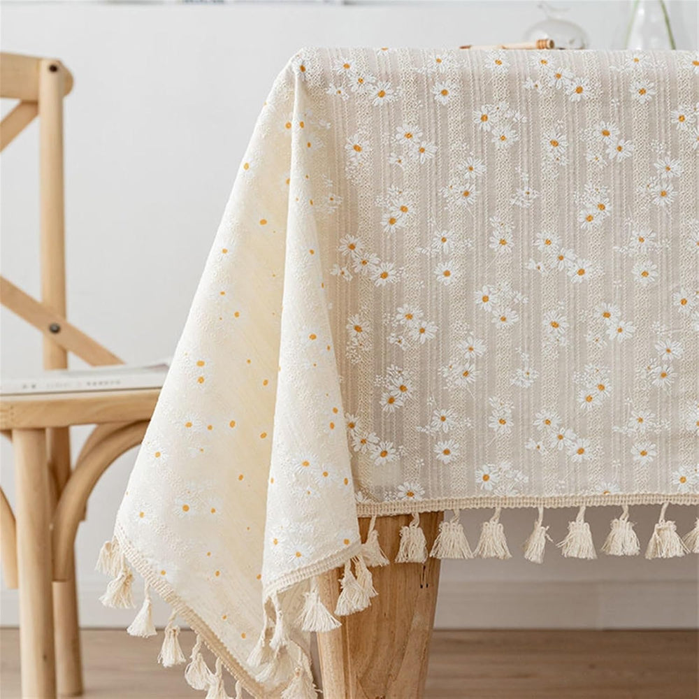 VibeCore Daisy Embroidered Linen Tablecloth in white, featuring delicate daisy embroidery and tassel accents, crafted from soft, durable linen for a fresh and elegant touch to your dining space.