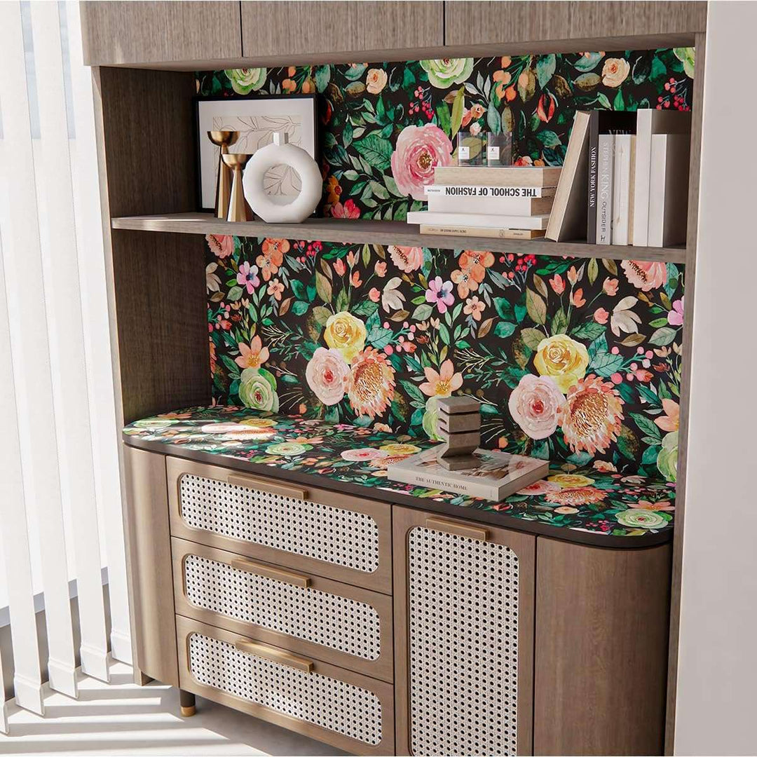 A view of the dark watercolor floral self-adhesive wallpaper as the backdrop behind a shelf, adding an artistic and modern touch to the space while highlighting the floral pattern.