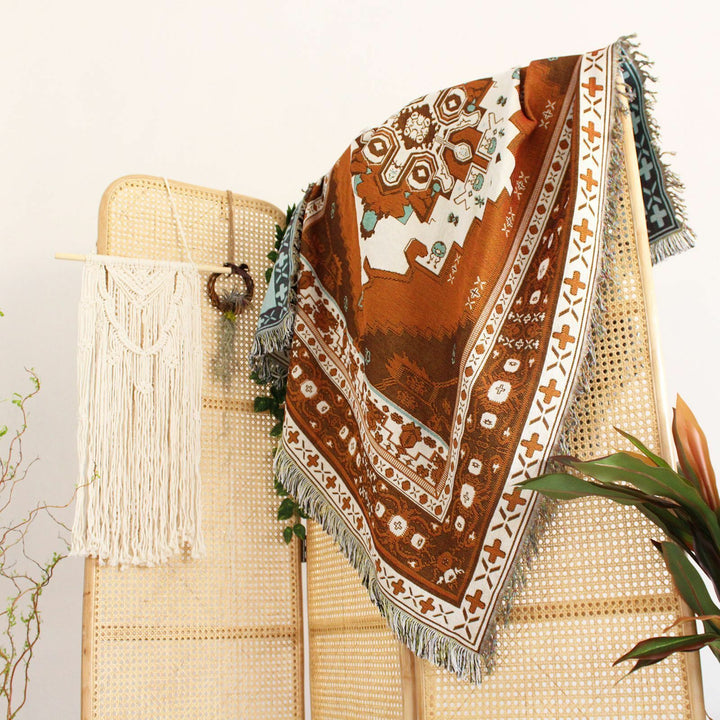 VibeCore Desert Mirage Woven Blanket draped on room divider - reversible boho cotton tapestry with tribal pattern for stylish space separation