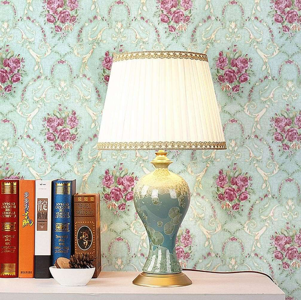 VibeCore European Light Green Floral Self-Adhesive Wallpaper on a wall behind a nightstand, featuring delicate floral patterns in a soft pale blue-green hue, adding elegance to the space.