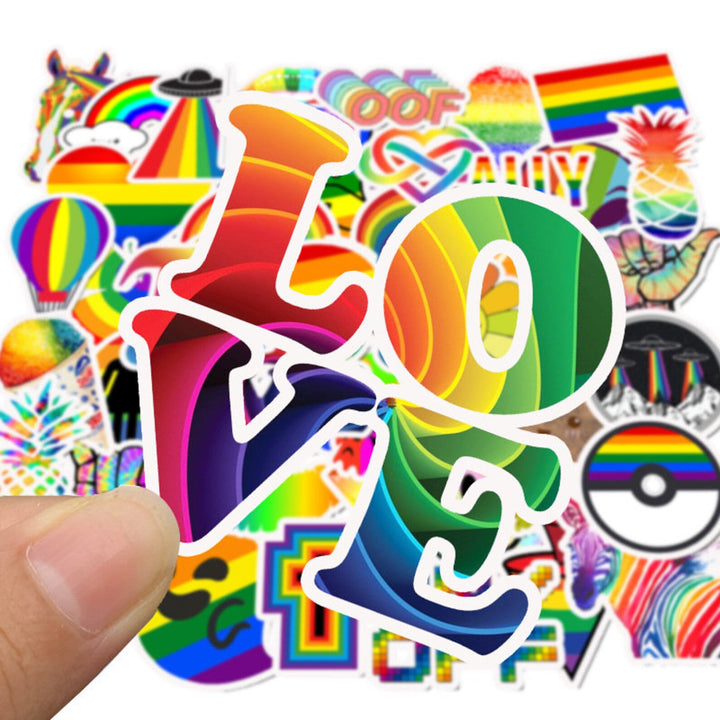 VibeCore Everything Rainbow Stickers Love Sticker close-up, showcasing a colorful design with the word "Love" in vibrant rainbow hues, perfect for adding a joyful touch to your accessories.
