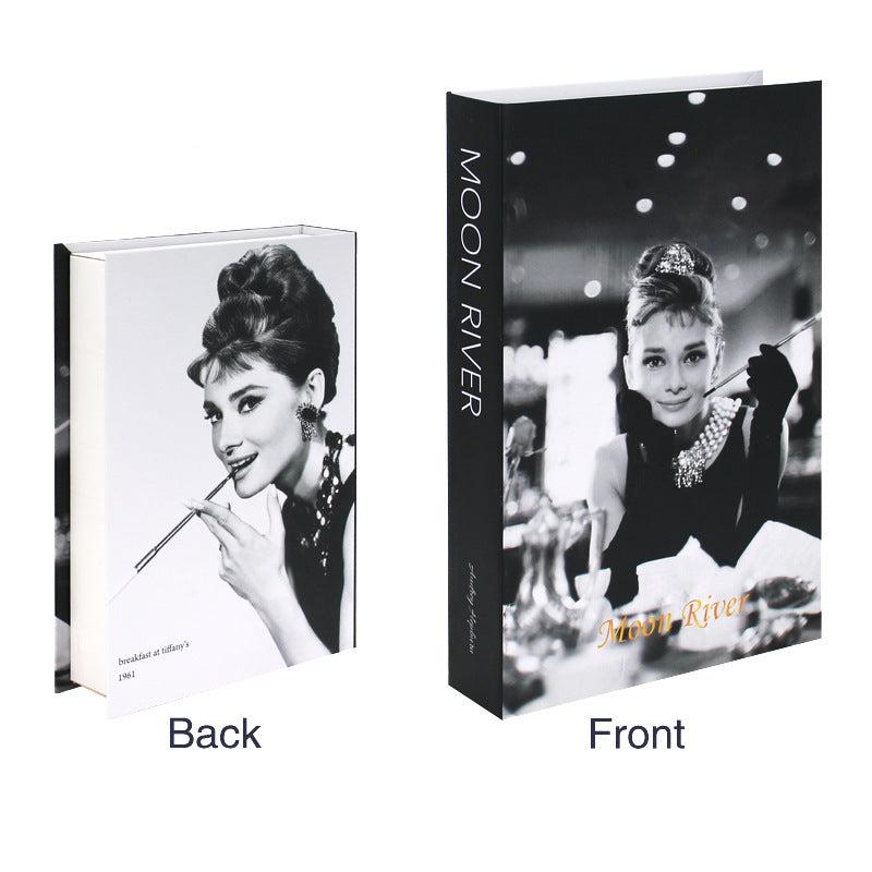 VibeCore Fashion Fake Book Storage Box on Coffee Table, featuring a chic design that looks like a stylish coffee table book, used for storing small items such as jewelry, stationery, or keepsakes, blending seamlessly into the decor of a living room or office.