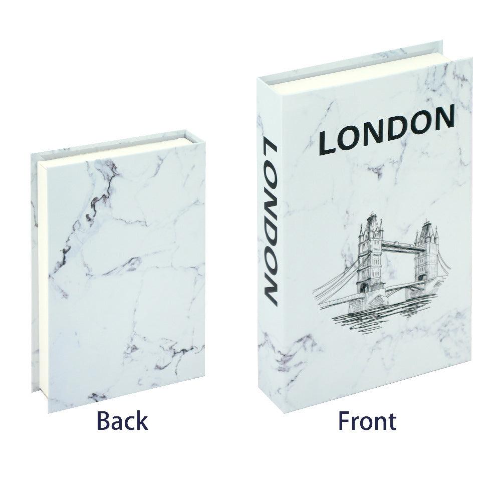 VibeCore Fashion Fake Book Storage Box on Coffee Table, featuring a chic design that looks like a stylish coffee table book, used for storing small items such as jewelry, stationery, or keepsakes, blending seamlessly into the decor of a living room or office.