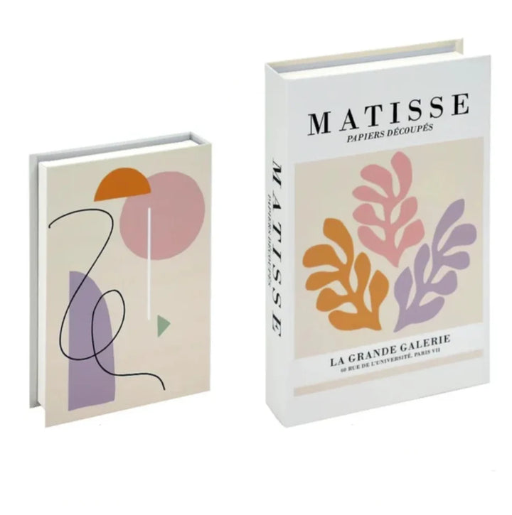 VibeCore Fashion Fake Book Storage Box on Coffee Table, featuring a chic design that looks like a stylish coffee table book, used for storing small items such as jewelry, stationery, or keepsakes, blending seamlessly into the decor of a living room or office.