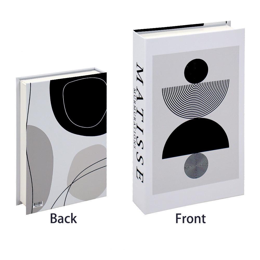 VibeCore Fashion Fake Book Storage Box on Coffee Table, featuring a chic design that looks like a stylish coffee table book, used for storing small items such as jewelry, stationery, or keepsakes, blending seamlessly into the decor of a living room or office.