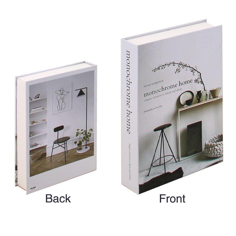 VibeCore Fashion Fake Book Storage Box on Coffee Table, featuring a chic design that looks like a stylish coffee table book, used for storing small items such as jewelry, stationery, or keepsakes, blending seamlessly into the decor of a living room or office.