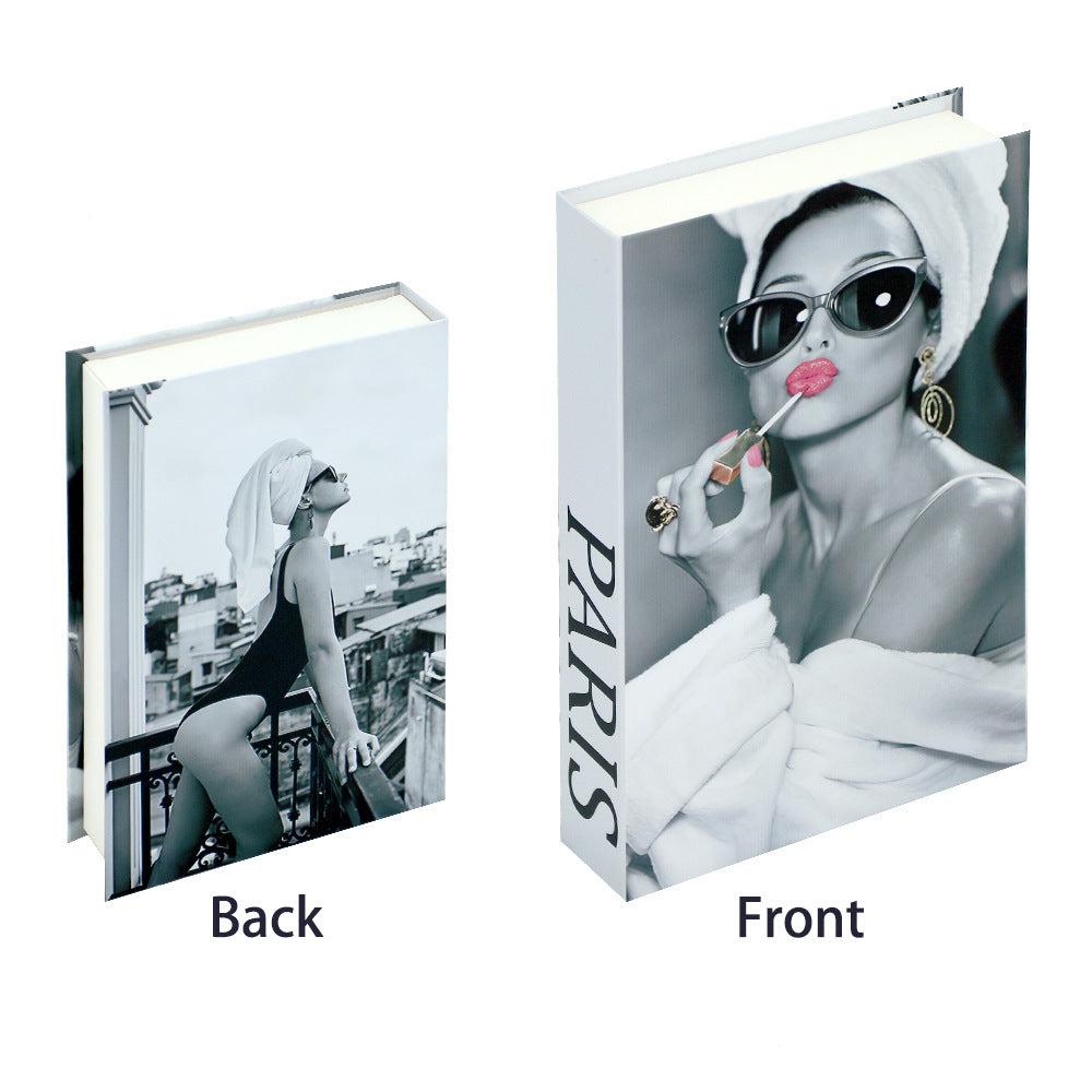 VibeCore Fashion Fake Book Storage Box on Coffee Table, featuring a chic design that looks like a stylish coffee table book, used for storing small items such as jewelry, stationery, or keepsakes, blending seamlessly into the decor of a living room or office.