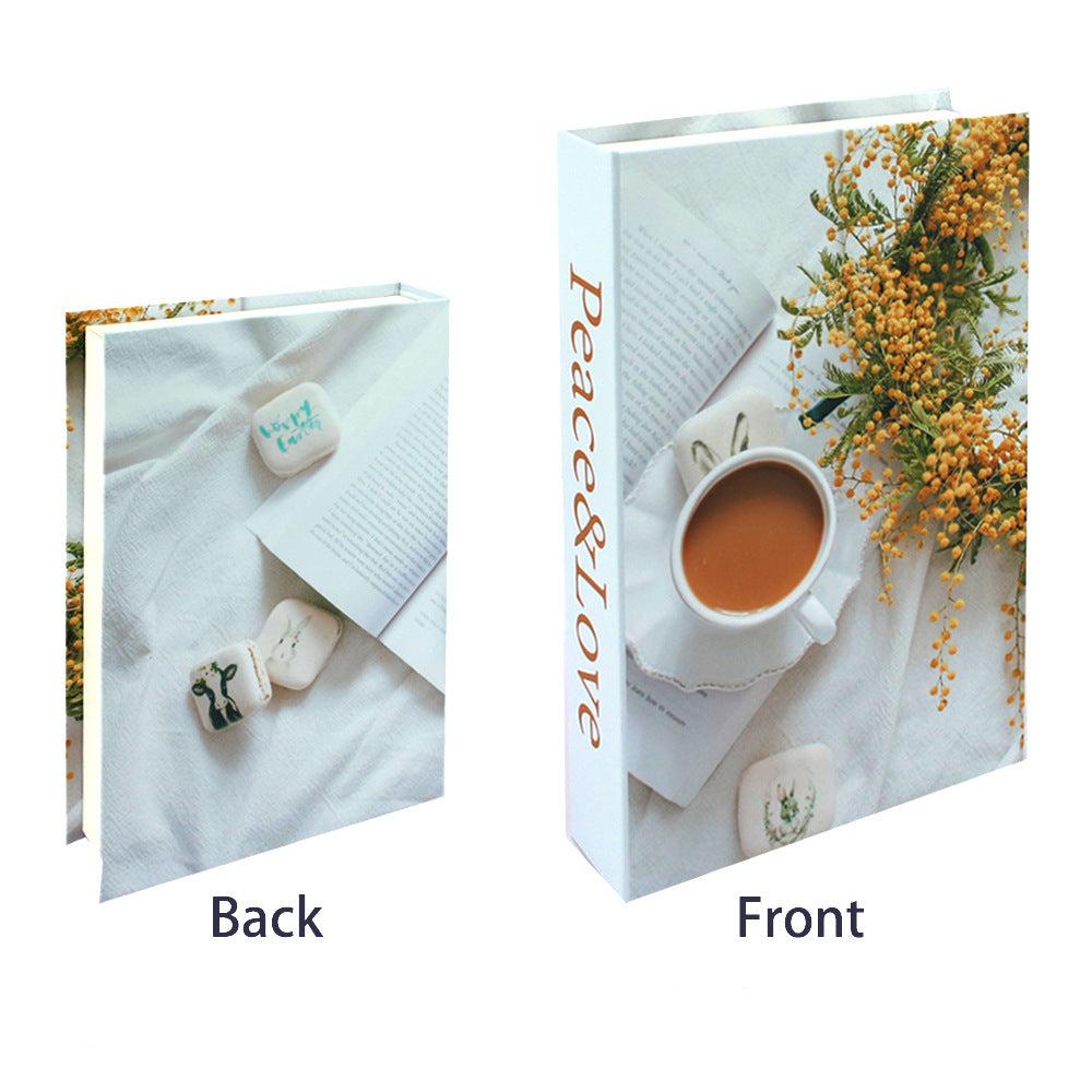 VibeCore Fashion Fake Book Storage Box on Coffee Table, featuring a chic design that looks like a stylish coffee table book, used for storing small items such as jewelry, stationery, or keepsakes, blending seamlessly into the decor of a living room or office.