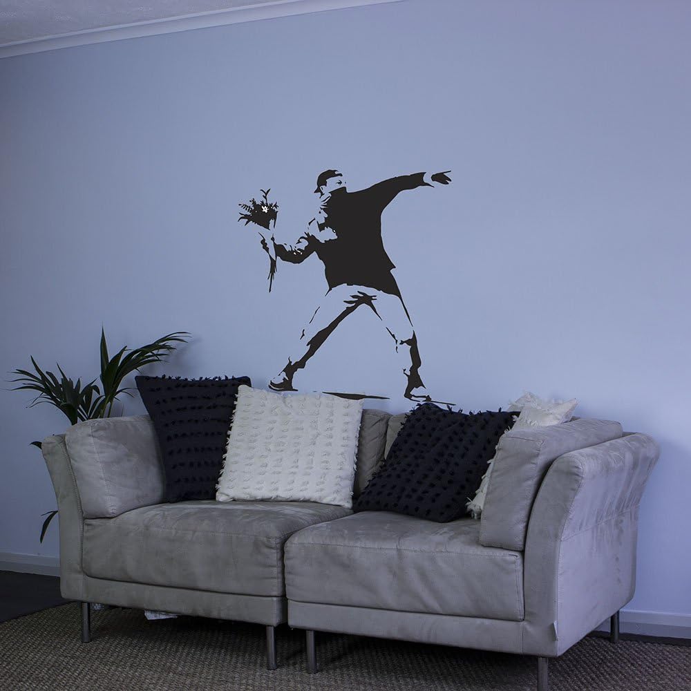 VibeCore Flower Grenade Wall Sticker on couch behind wall – bold, artistic waterproof PVC wall decal for modern bedroom, living room, or office – easy to apply, durable, stain and moisture-resistant