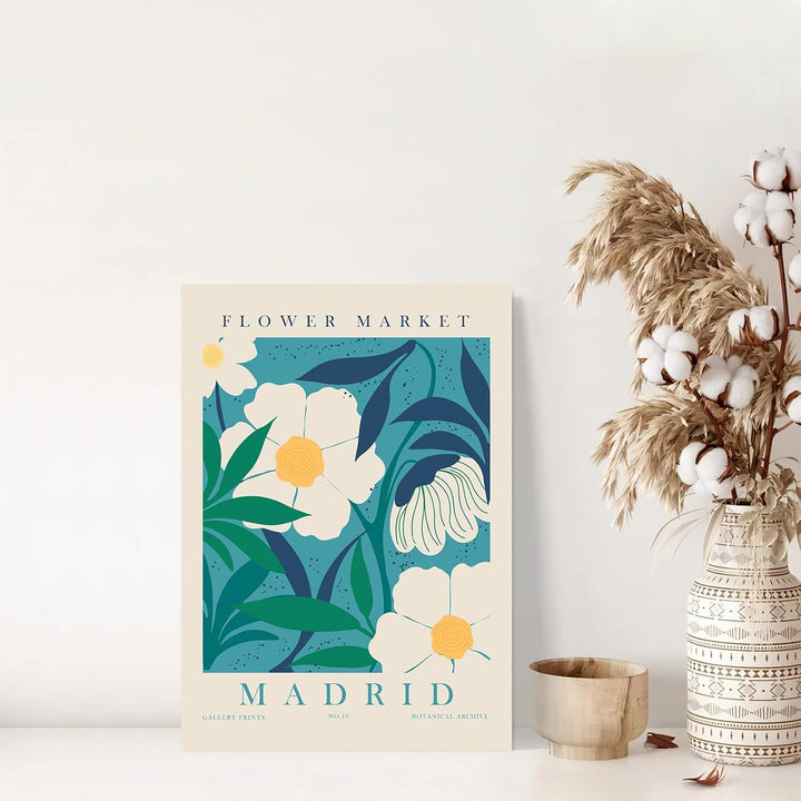 "VibeCore Flower Market Cities Canvas Posters" showcasing a vibrant floral print inspired by the lively flower markets of Madrid. This artwork brings the essence of Spain's colorful blooms and dynamic culture into your space, adding an aesthetic and refreshing touch to any room. Perfect for those who love botanical beauty and a worldly vibe.