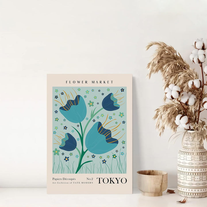"VibeCore Flower Market Cities Canvas Posters" featuring a vibrant floral print inspired by the bustling flower markets of Tokyo. The artwork showcases colorful blooms against the backdrop of Tokyo's unique aesthetic, adding a lively and exotic touch to your decor. Perfect for brightening up any space with a floral flair.