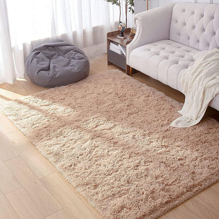 VibeCore Fluffy Area Rug in Beige placed in a cozy living room, adding a soft, plush texture to the space and enhancing the room's warmth and comfort.