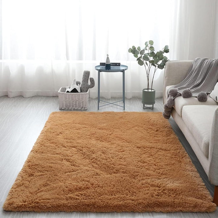 VibeCore Fluffy Area Rug in Camel placed in a cozy living room, showcasing its soft texture and warm color that complements the room's aesthetic and adds comfort to the space.