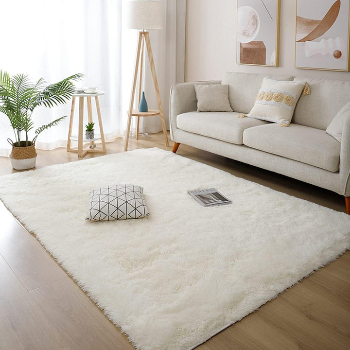 VibeCore Fluffy Area Rug in Cream placed in the living room, complementing the space with its soft, cozy texture and neutral color, perfect for creating a welcoming atmosphere.