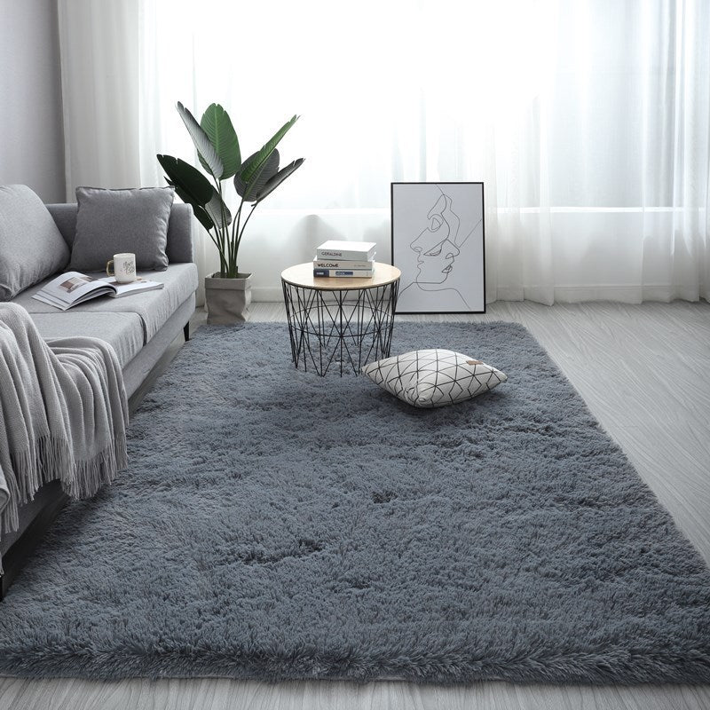 VibeCore Fluffy Area Rug in Gray, offering a soft, plush texture that adds a cozy touch to any room with a modern, neutral tone. Ideal for creating a comfortable and stylish atmosphere.