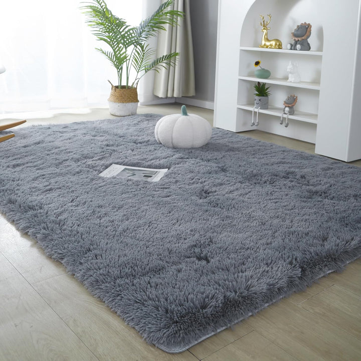 VibeCore Fluffy Area Rug in Gray, laid out on the floor, offering a soft and cozy texture that enhances the room's ambiance with its plush design.