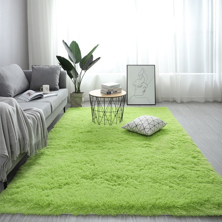 VibeCore Fluffy Area Rug in Green, offering a soft and plush texture that adds a vibrant touch to any room's decor. Perfect for enhancing comfort and style.