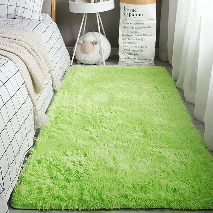 VibeCore Fluffy Area Rug in Green, positioned beside the bed, enhancing the room with a soft and vibrant touch of color.