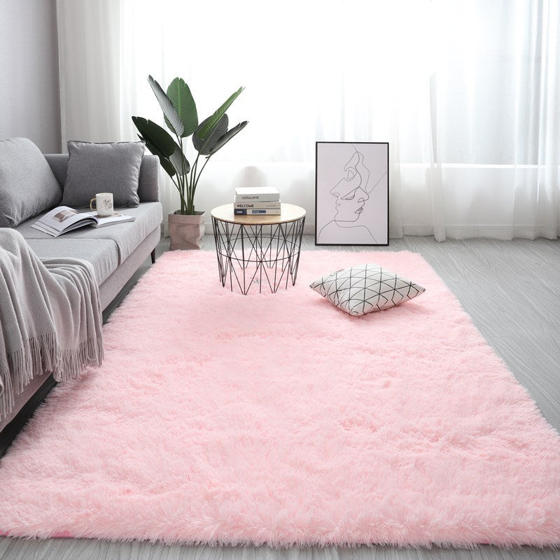 VibeCore Fluffy Area Rug in Light Pink, adding a soft, cozy vibe to any room with its plush texture and gentle pastel color.