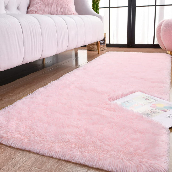 Close-up of the VibeCore Fluffy Area Rug in Light Pink, showcasing its plush, soft texture and delicate pastel hue.