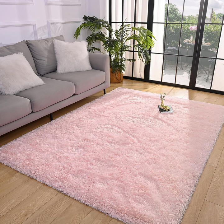 VibeCore Fluffy Area Rug in Light Pink placed in a cozy living room, adding a soft, pastel touch to the space with its plush texture and calming color.