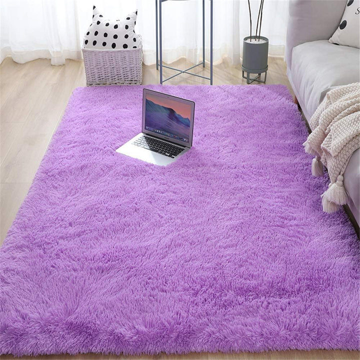 Close-up of the VibeCore Fluffy Area Rug in Purple, showcasing its soft, plush texture and vibrant hue, perfect for adding a cozy touch to any space.