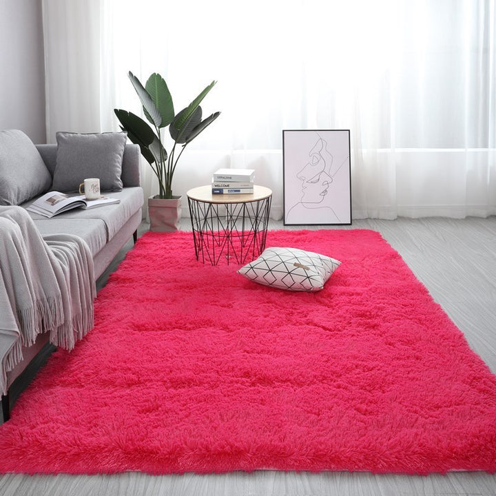 The VibeCore Fluffy Area Rug in Rose Red, featuring a plush, soft texture, adding a vibrant pop of color to the room with its rich, warm hue.