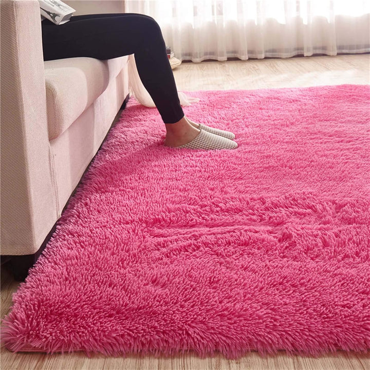Close-up of the VibeCore Fluffy Area Rug in Rose Red, showcasing its luxurious, plush texture and rich, deep color for a cozy and vibrant addition to any space.