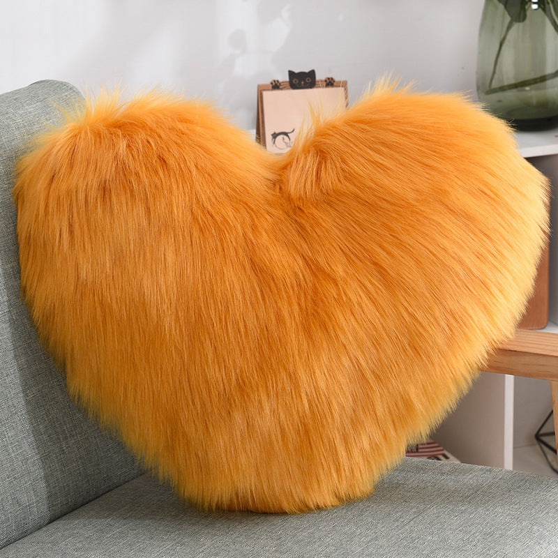 VibeCore Fluffy Heart Throw Pillow in orange - soft faux fur, heart-shaped design, perfect for adding a warm, playful touch to any room.