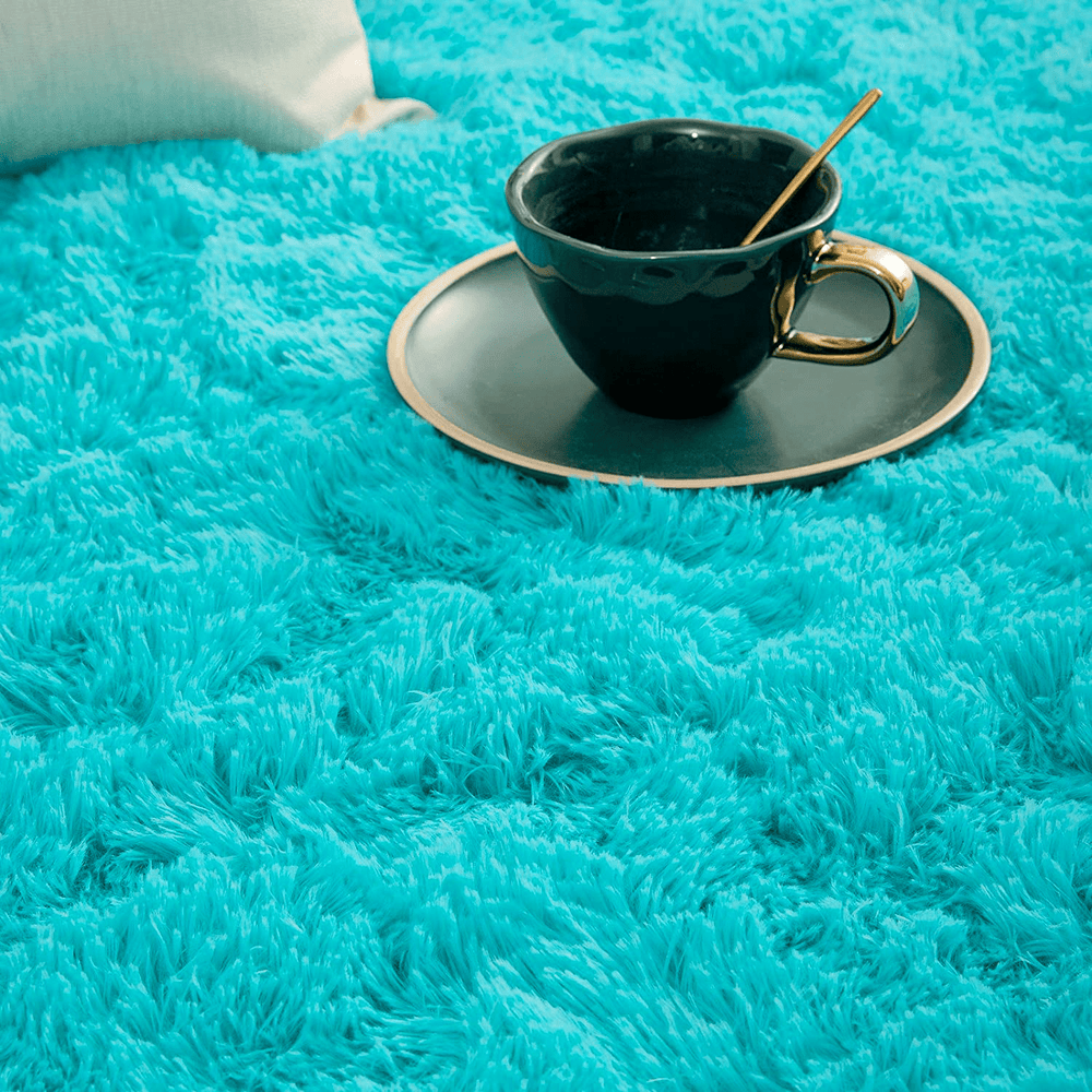 VibeCore Fluffy Round Area Rug in aqua, close-up view showcasing its soft plush texture and cozy feel. Non-slip backing for stability, perfect for bedroom, living room, or dorm. Easy to clean and available in 8 colors.