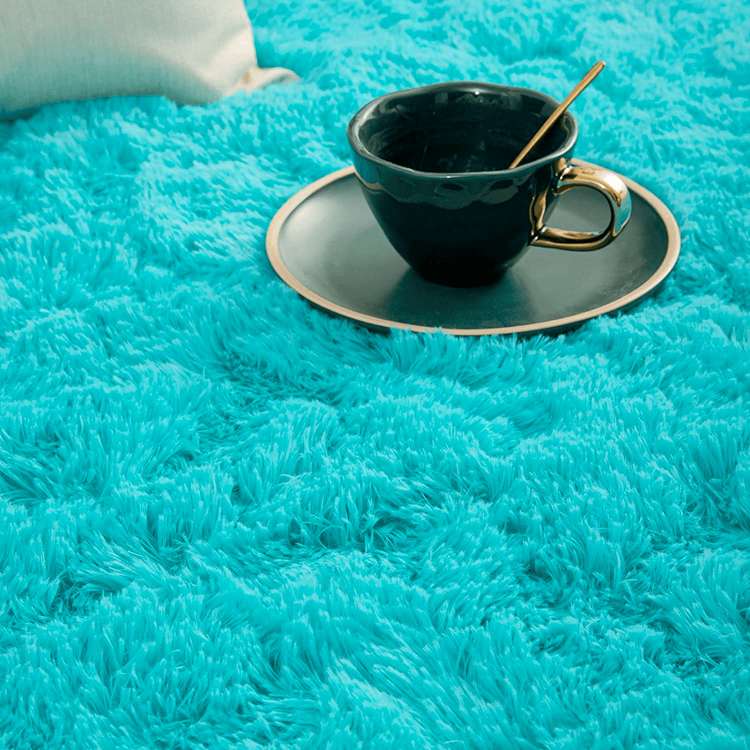 VibeCore Fluffy Round Area Rug in aqua, close-up view showcasing its soft plush texture and cozy feel. Non-slip backing for stability, perfect for bedroom, living room, or dorm. Easy to clean and available in 8 colors.