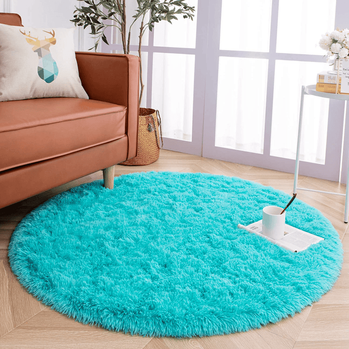 VibeCore Fluffy Round Area Rug in aqua placed in a living room, featuring a soft plush texture and non-slip backing. Cozy and stylish, perfect for adding comfort to any space. Easy to clean and available in 8 colors.