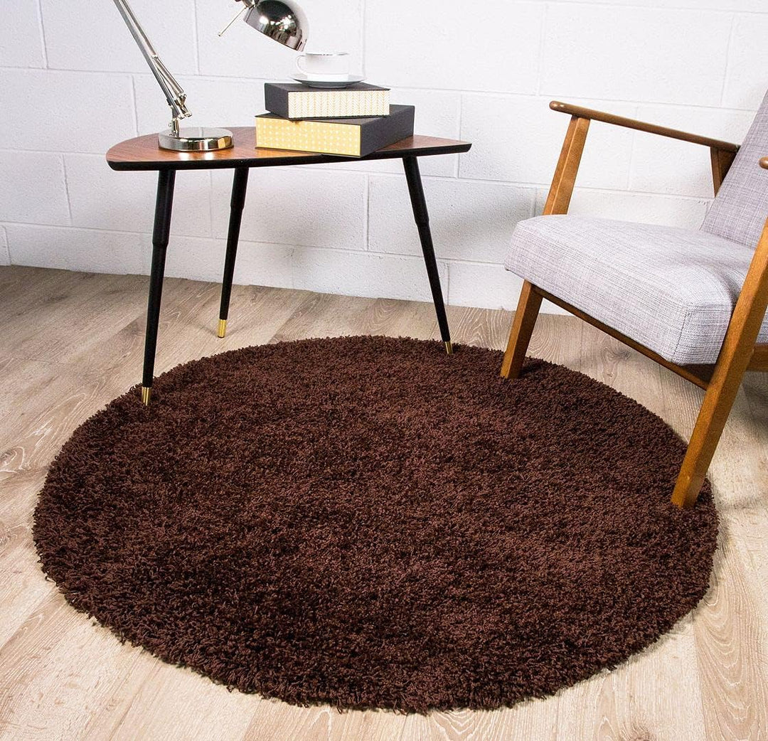 VibeCore Fluffy Round Area Rug in brown on the floor, featuring a soft plush texture and non-slip backing. Cozy and stylish, perfect for bedrooms, living rooms, or dorms. Easy to clean and available in 8 colors.