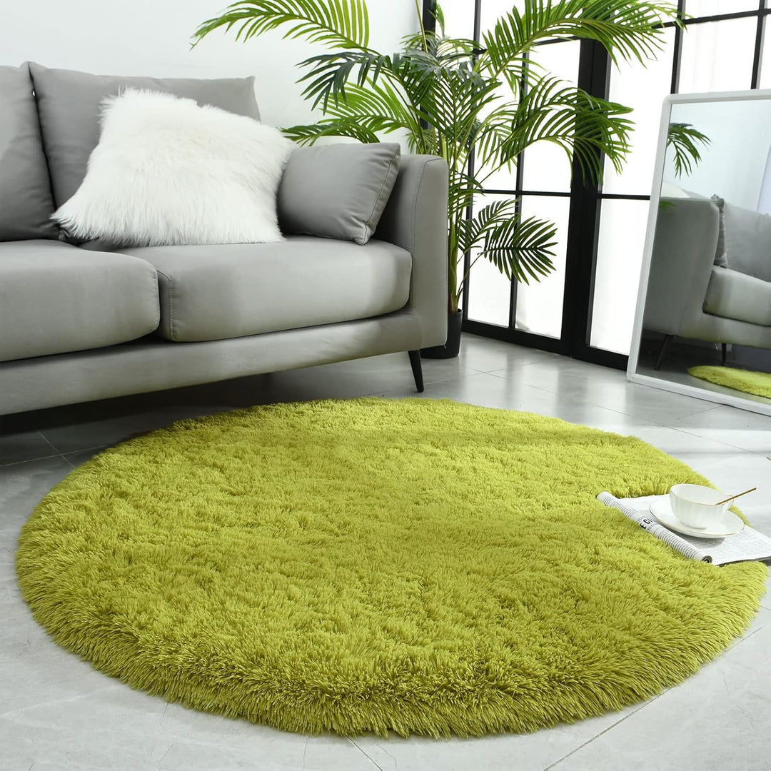 VibeCore Fluffy Round Area Rug in green placed in a living room, featuring a soft plush texture and non-slip backing. Cozy and stylish, perfect for adding comfort to any space. Easy to clean and available in 8 colors.