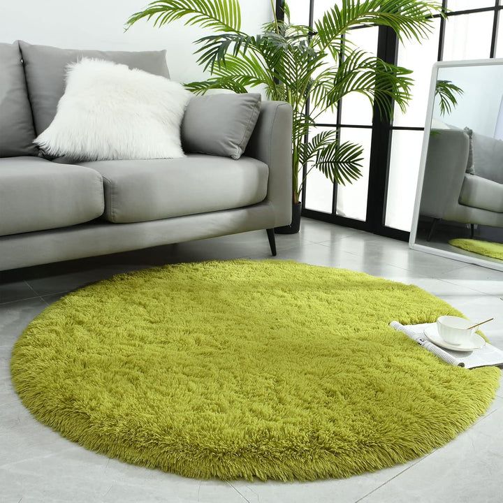 VibeCore Fluffy Round Area Rug in green placed in a living room, featuring a soft plush texture and non-slip backing. Cozy and stylish, perfect for adding comfort to any space. Easy to clean and available in 8 colors.