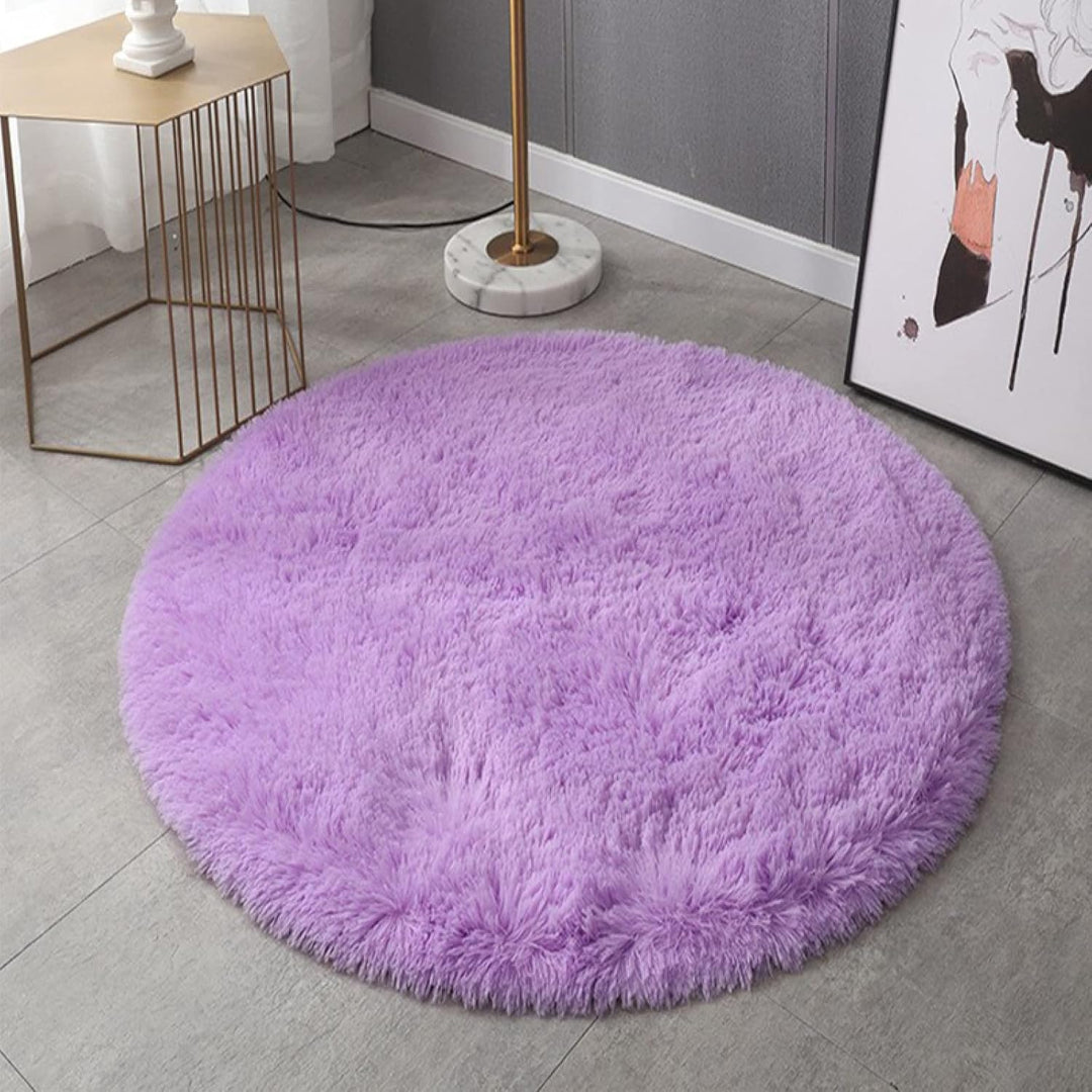 VibeCore Fluffy Round Area Rug in purple on the floor, featuring a soft plush texture and non-slip backing. Cozy and stylish, perfect for bedrooms, living rooms, or dorms. Easy to clean and available in 8 colors.
