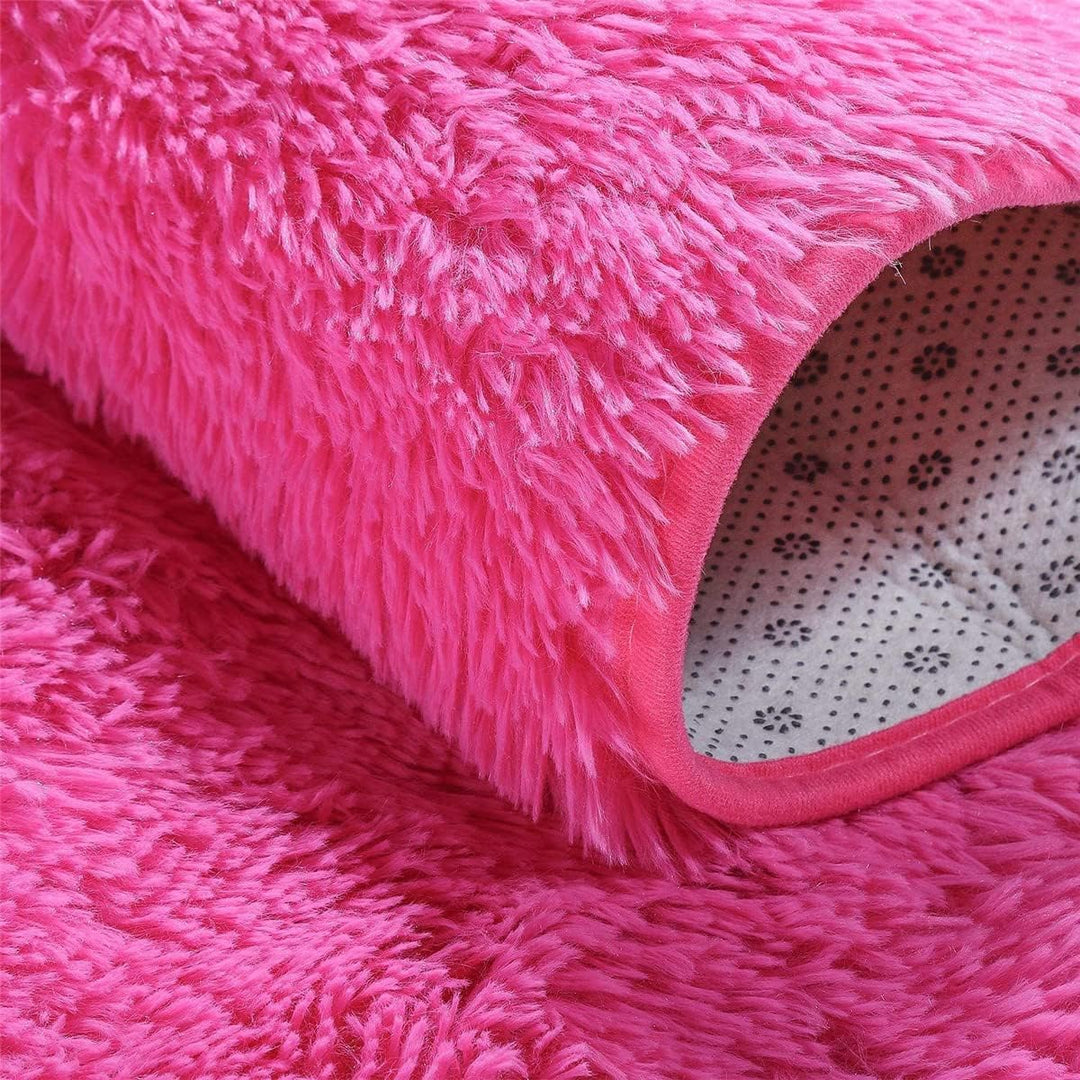VibeCore Fluffy Round Area Rug in rose red, close-up view showcasing its soft plush texture and cozy feel. Non-slip backing for stability, perfect for bedroom, living room, or dorm. Easy to clean and available in 8 colors.